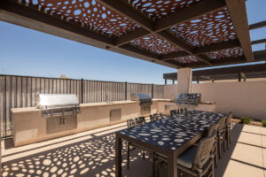 BBQ and alfresco dining area at Delhaven Pointe with grills and a table