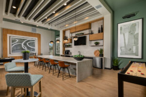 resident clubhouse at Delhaven Pointe with demonstration kitchen and barstools