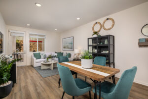 spacious apartment floor plan with a kitchen table and living room couch