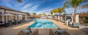 swimming pool at Delhaven Pointe surrounded by lounge furniture